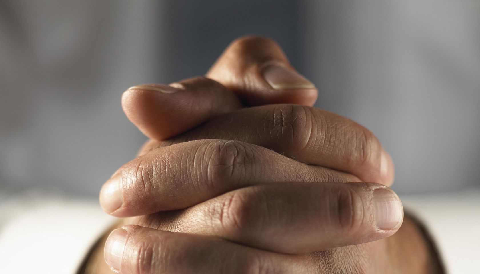 Close up on Two Hands Folded Together