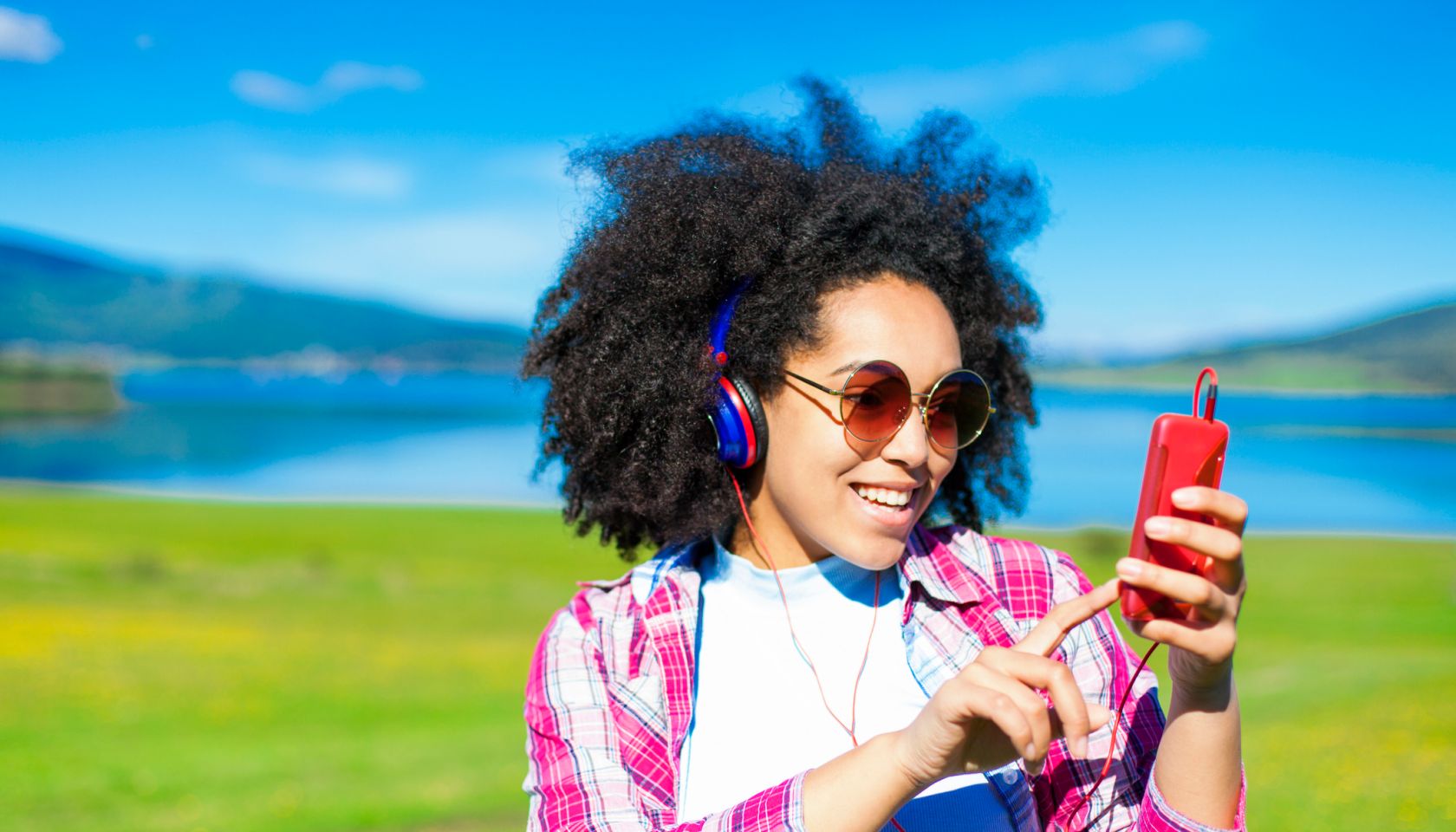 Woman listening to music in the nature.