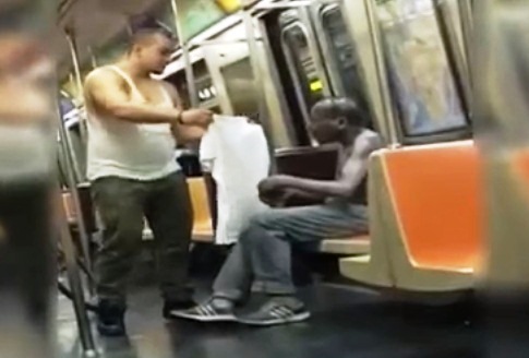 Man Gives His Shirt and Hat to a Homeless Man