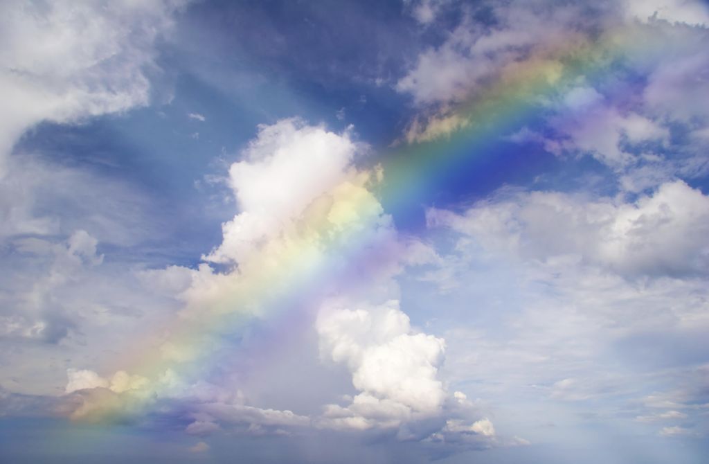 Abstract rainbow on the sky with clouds