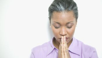 African American woman praying