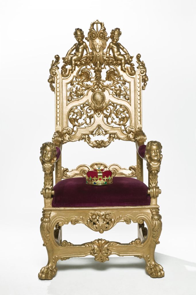 Kings crown sitting on throne