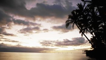 Sunset over ocean and tropical beach