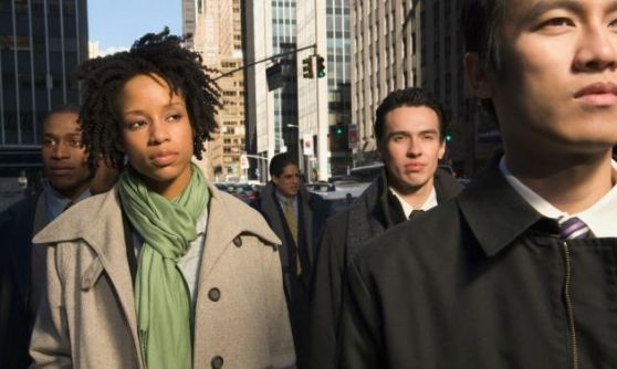 Black woman thinking in crowd