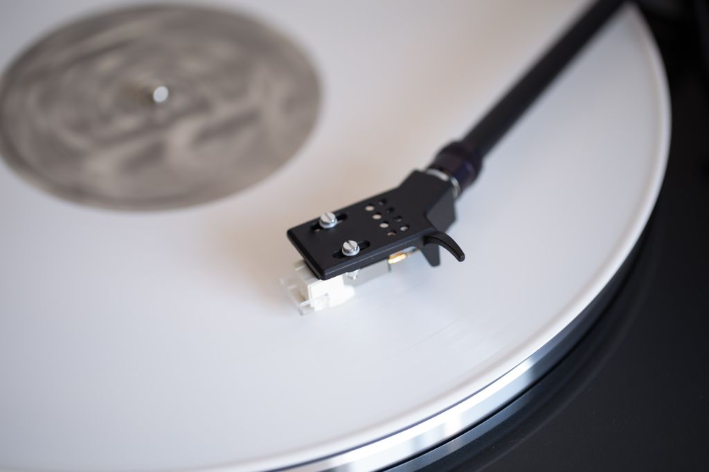White colored vinyl record played on a turntable