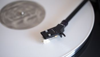 White colored vinyl record played on a turntable