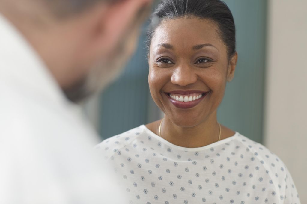Woman patient smiling at doctor
