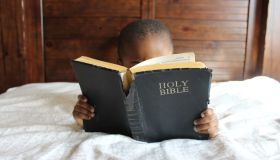 Child Reading The Bible