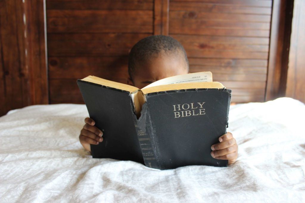 Child Reading The Bible