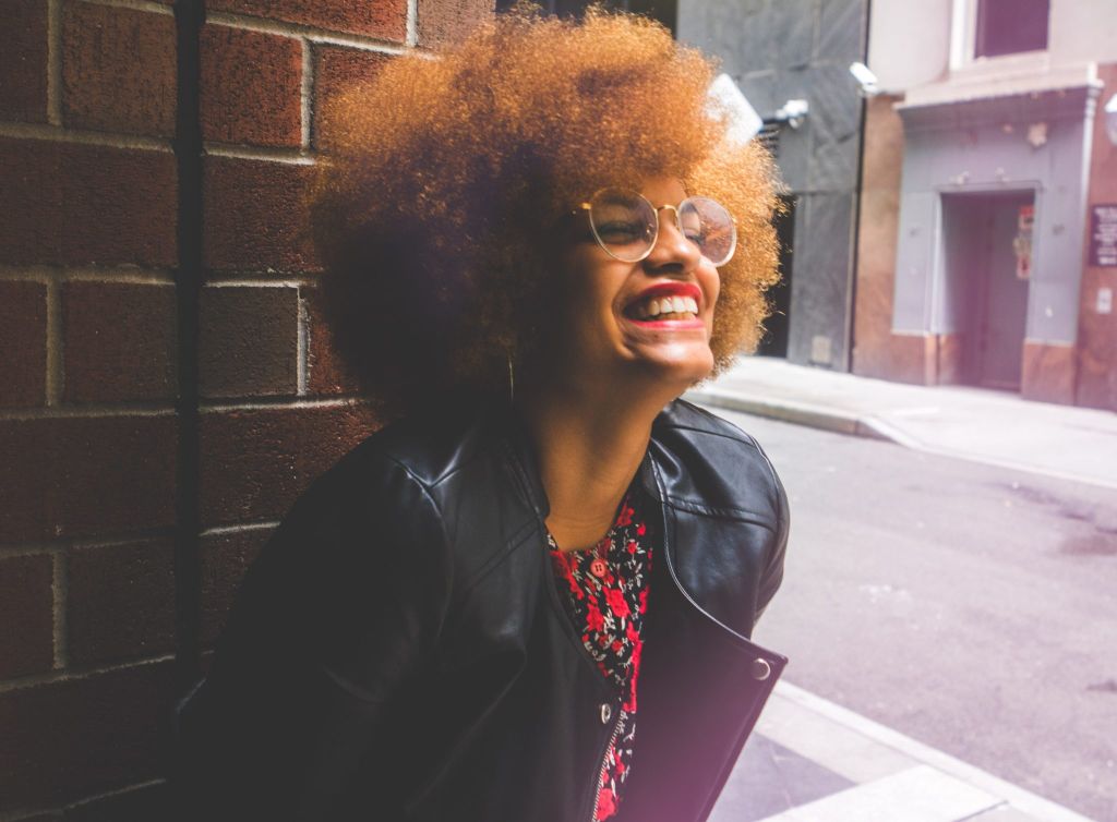 Woman with Afro Smiling