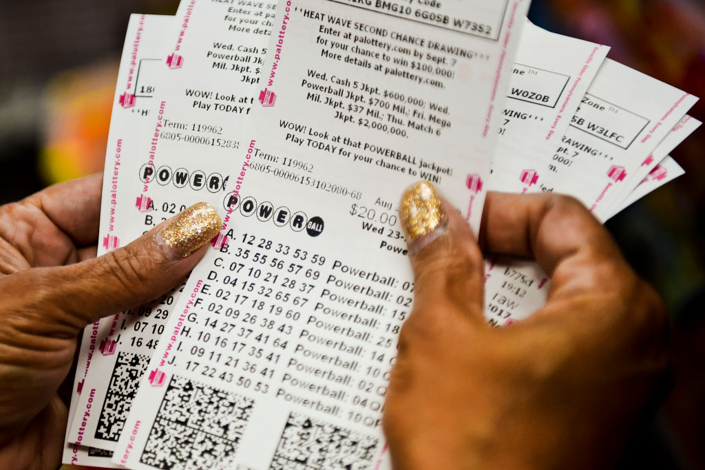 Doris Natal of Reading checks out her 126 Powerball tickets as part of a pool with the Berks County Sheriff's Office at the Sunoco in Exeter. Photo by Natalie Kolb 8/23/2017