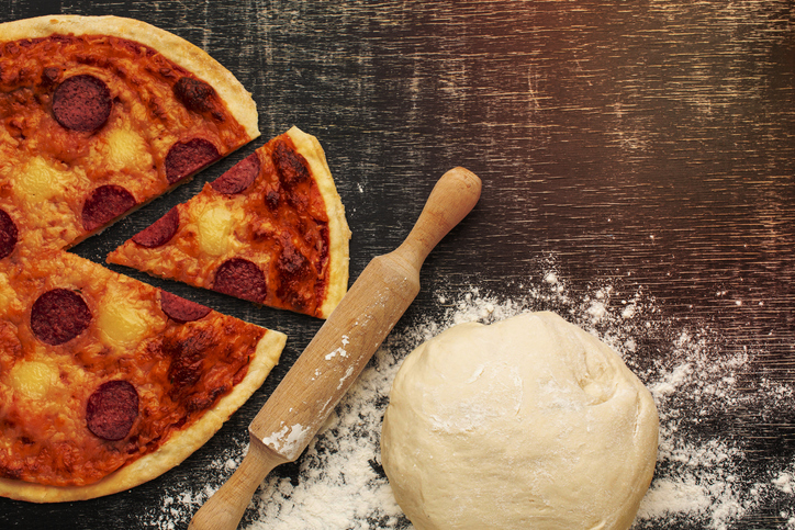 Top view tasty pizza and dough
