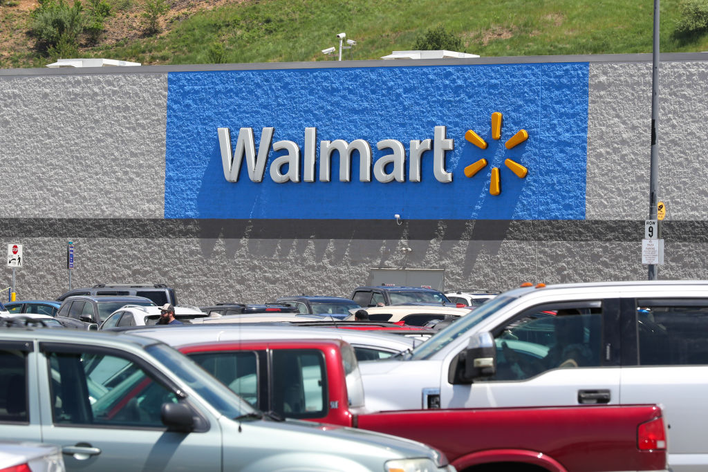 Cars fill the parking lot of the Walmart store at the...